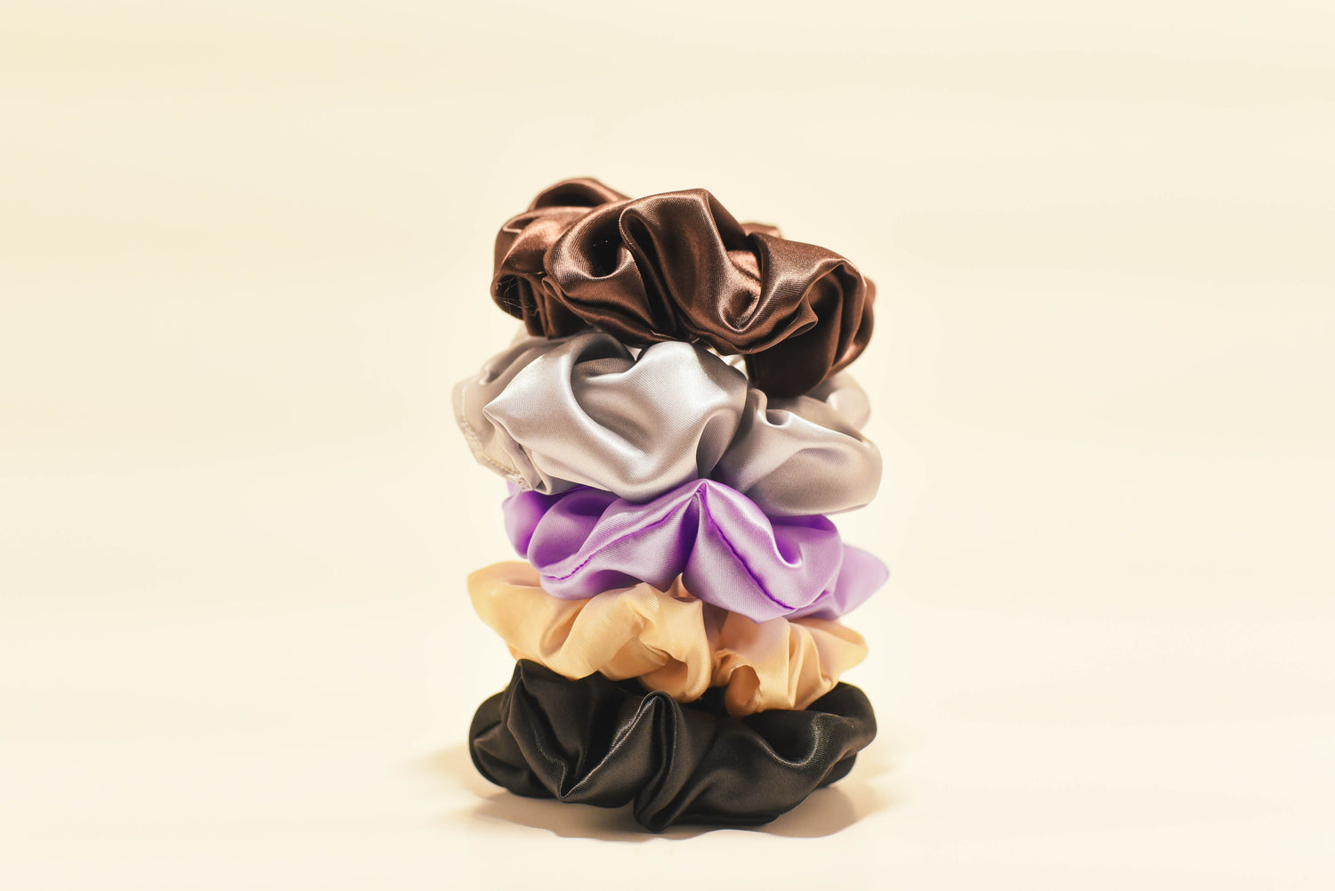 100% pure essential oil infused aromatic loops fragrance scrunchies stacked with premium background