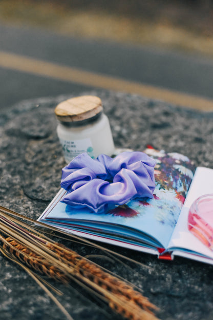 "Aroma Loops essential oil-infused Lavneder scrunchie offering natural scent and wellness benefits."